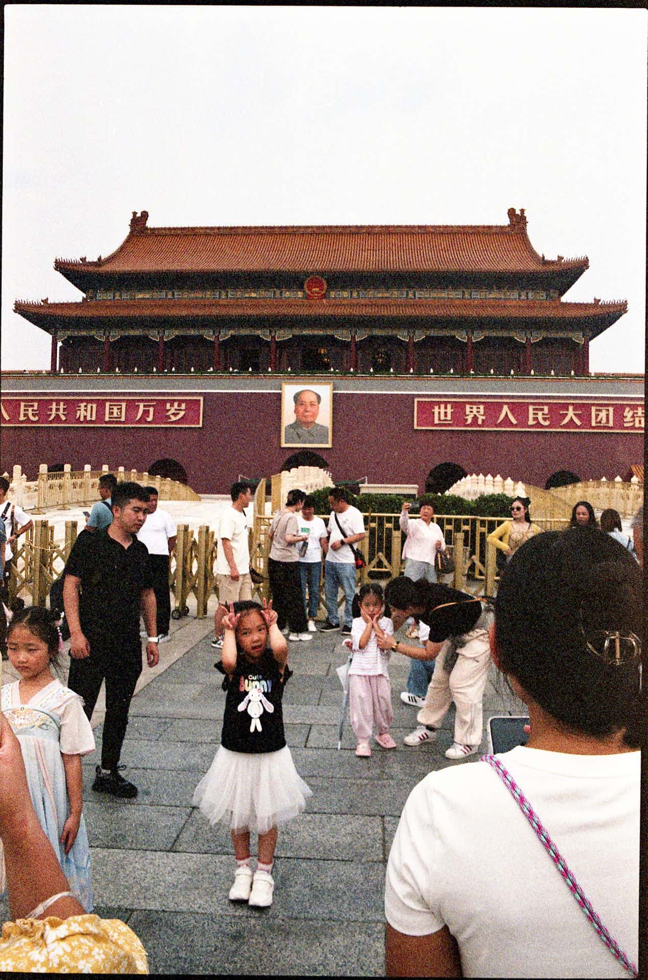 A little girl playing at Tiananmen Square in Beijing China 35mm film photography
